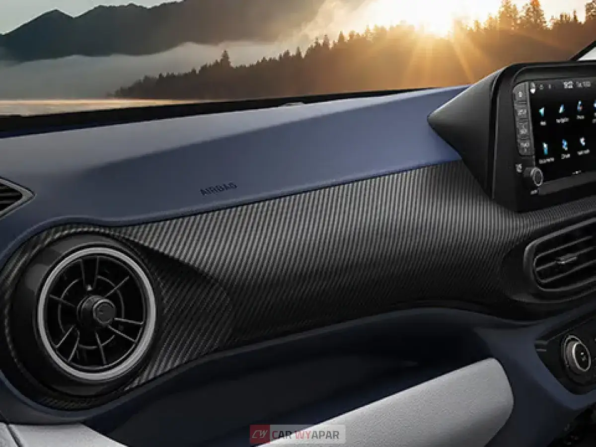 Detailed view of the dashboard texture and circular air vent.